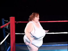 Fat midget girl is shoving a dildo in lesbian midget’s pussy
